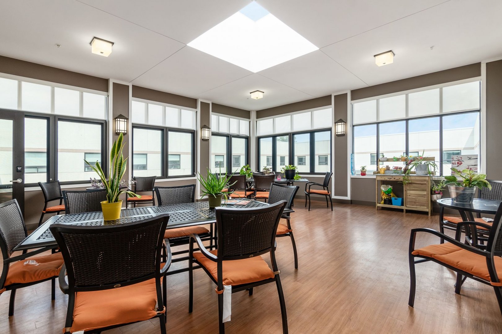 Bright communal living space with modern furniture and large windows in Lewis Center, OH.