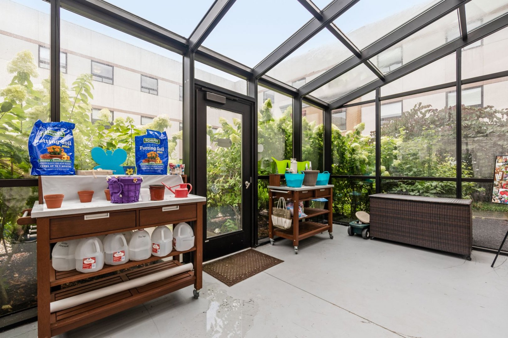 Sunny indoor garden area with potting supplies at a senior living community in Lewis Center, Ohio.
