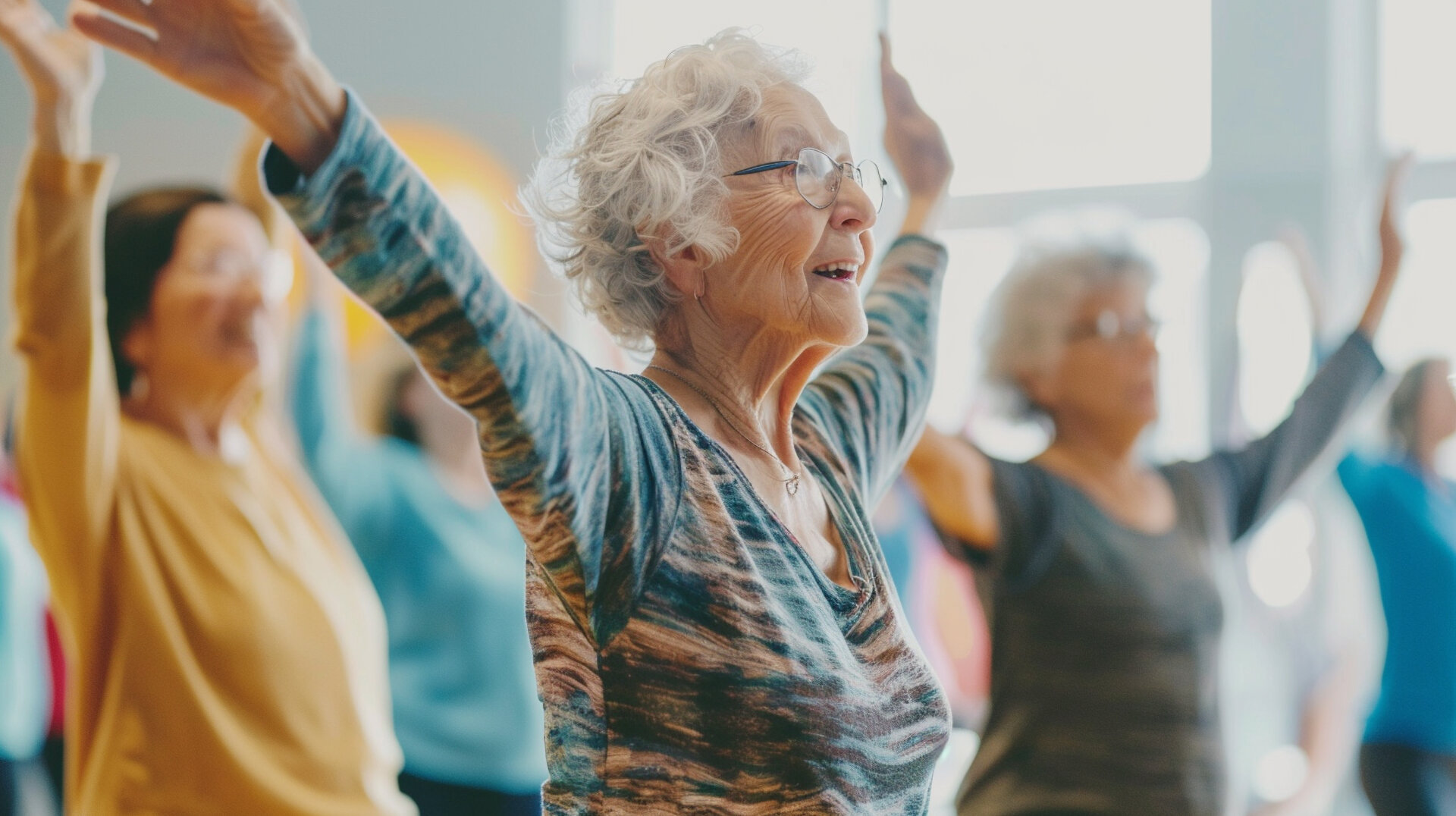 Seniors stretching in group yoga class